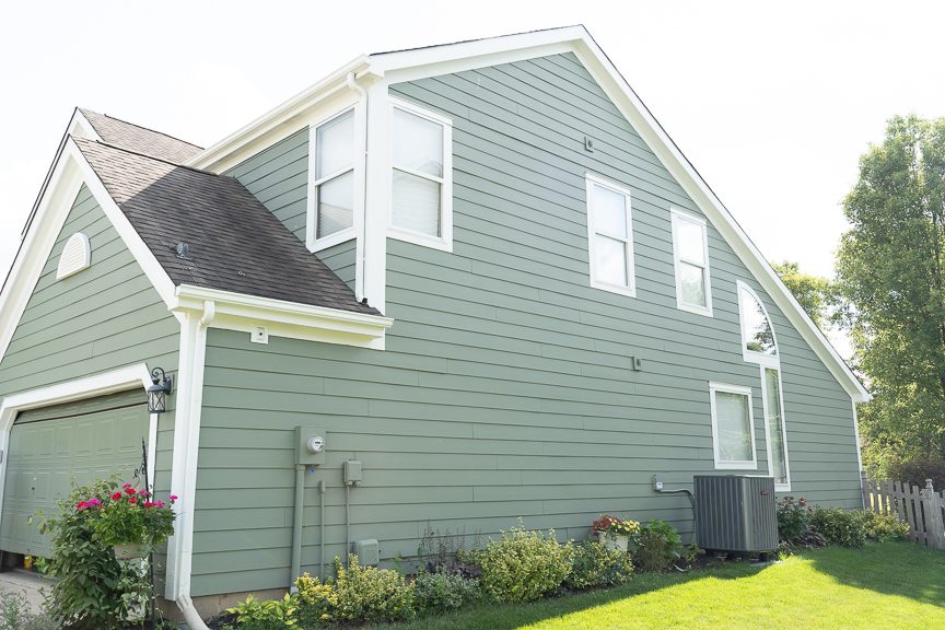 side of home painted green with white trim Preview Image 3