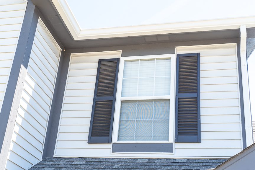 white siding with dark gray shutters close up Preview Image 4