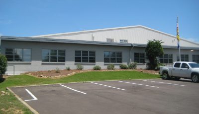 Front View of completed exterior painting project for Manufacturing Plant in Madison, MS