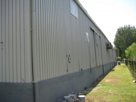 Manufacturing Plant's metal siding after completed painting project by CertaPro Jackson, MS