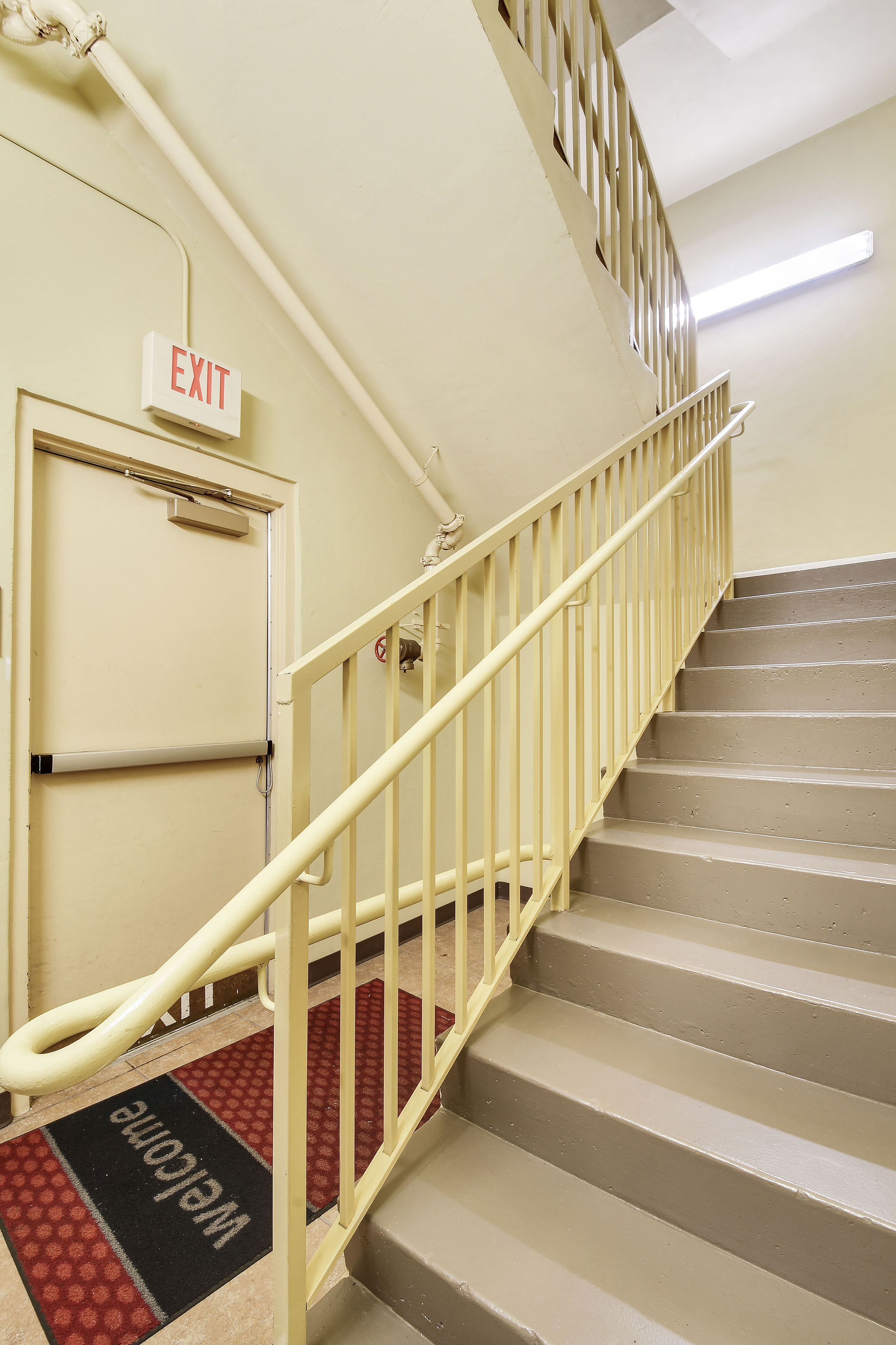 Walls, railings and stairs painted in this commercial stairwell by CertaPro Painters of Jupiter, FL