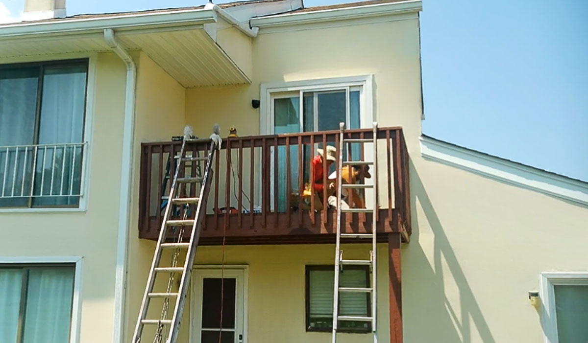 Crew Replacing Nails and Sanding