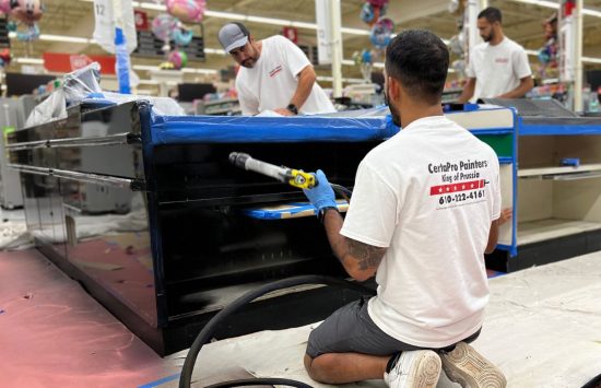Staff Applying Paint to a commercial property