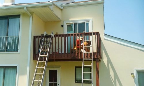 Crew Replacing Nails and Sanding (During)