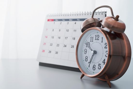 Flexible scheduling photo of a clock and calendar