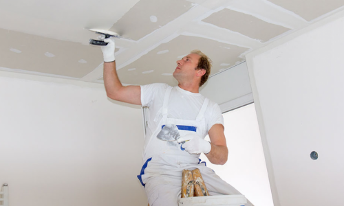 worker painting ceiling