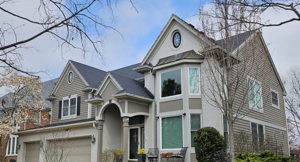 Tan exterior painting in Indian Head Park home.