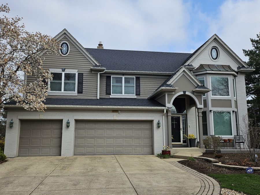 Tan exterior painting with refreshed shudders and garage door protective coat in Indian Head Park. Preview Image 1