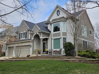 Tan exterior painting in Indian Head Park home.