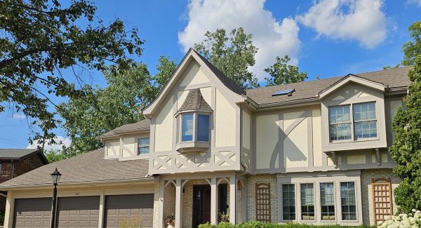 Beige exterior painting services in Oak Brook by CertaPro Painters of La Grange.
