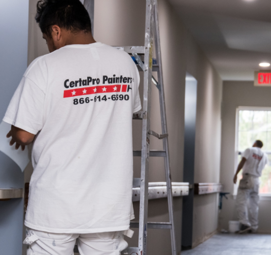 Office and commercial interior painting for hallway.