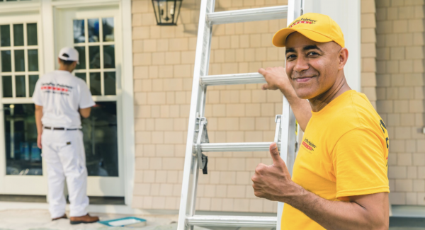 certapro worker giving thumbs up during house painting
