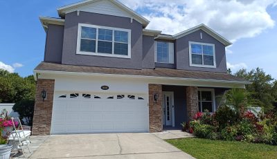 Exterior painting in Auburndale, FL in dark grey paint.