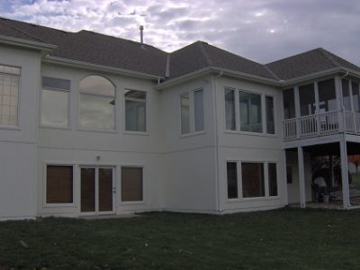 Exterior house painting by CertaPro painters in Lee's Sumit, MO