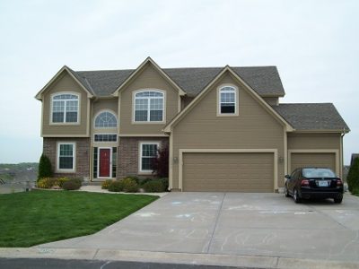 Exterior house painting by CertaPro painters in Lee's Summit, MO