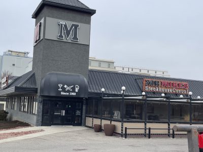 greay painted restaurant exterior