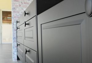 dark colored cabinet in kitchen