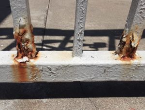 rusting metal railing