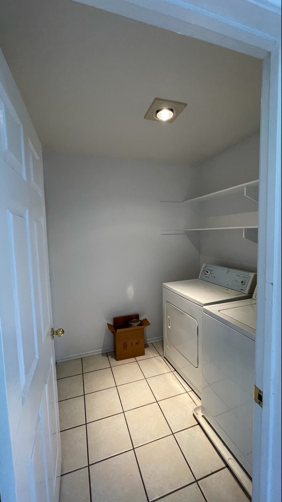 A laundry room painted a very light gray. Preview Image 1