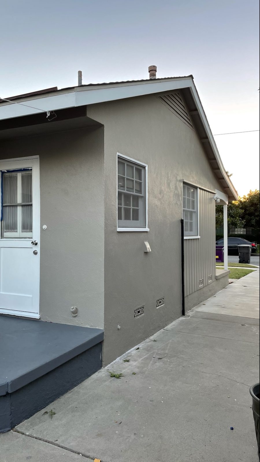 taupe colored stucco paired with a dark gray concrete deck. Preview Image 2