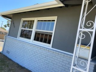 gray stucco and light gray brick exterior. Preview Image 1