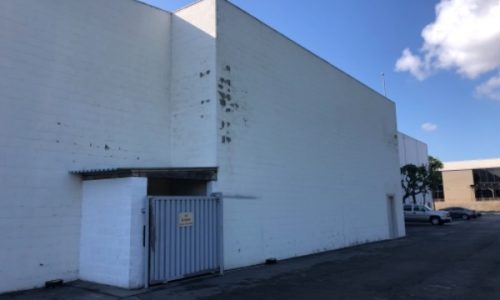 Failing Paint on Back of Building