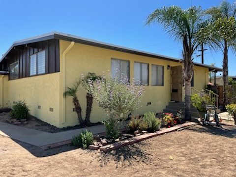 This house was painted yellow and dark brown. Preview Image 1