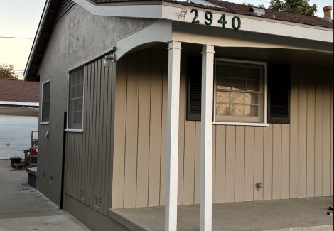 stucco and texture 111 exterior painted a shade of taupe.