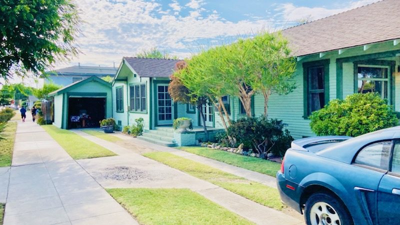 street view of light green house with green trim. Preview Image 3