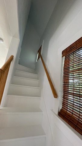 staircase with treaters and risers painted white. Preview Image 1