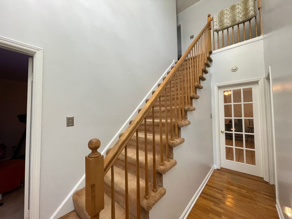 After Photo of Stairway wall repainted white