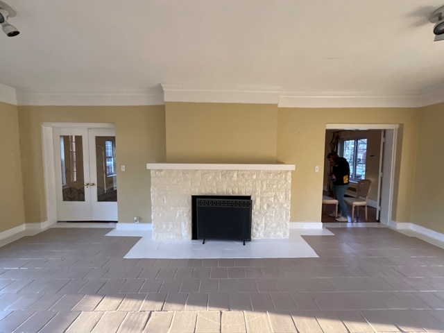 photo of living room and fireplace before being repainted