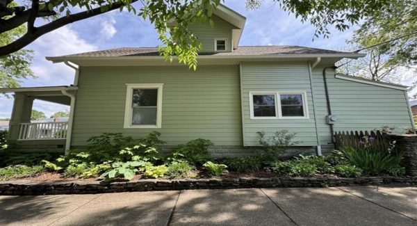 photo of house exterior being repainted in louisville