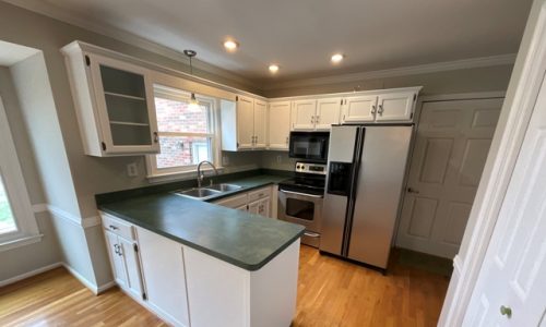 photo of repainted kitchen cabinets in st. regis park