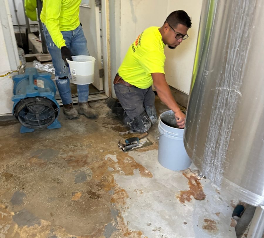 Gill Dairy Case Study floor before photo of flooring being prepared behind equipment Preview Image 2