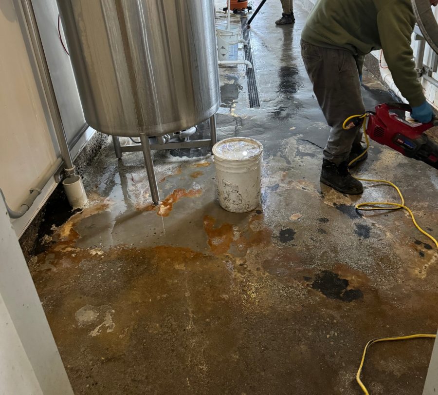 Gill Dairy Case Study floor before photo of flooring being prepared behind equipment another angle Preview Image 3