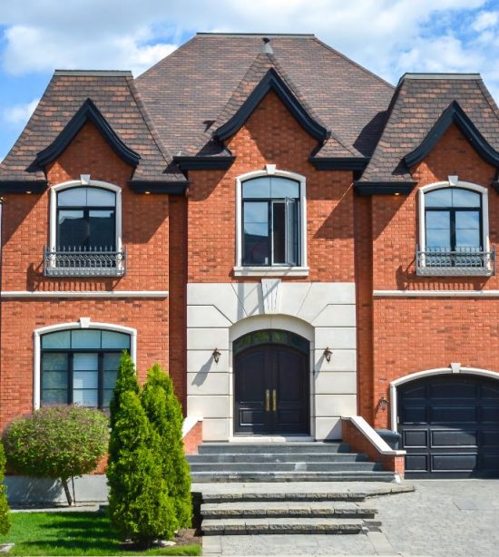brick house with black doors and trim