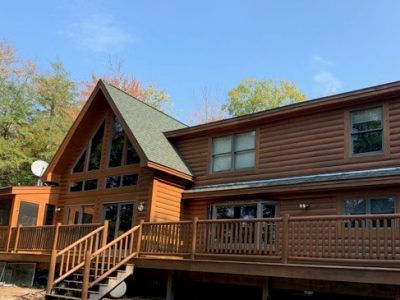 Log Home in Freeport after completed log home staining by certapro painters of maine