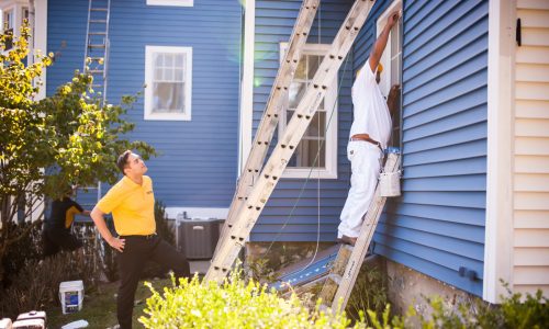 certapro crew members painting vinyl siding blue