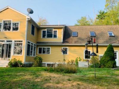 yellow painted home in maine