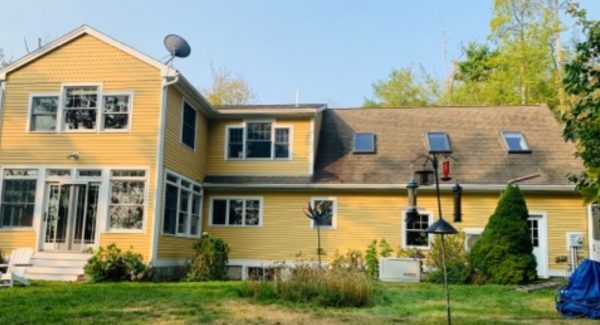 yellow painted home in maine