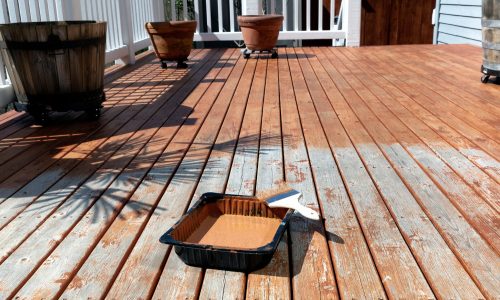 stain to paint being applied to deck