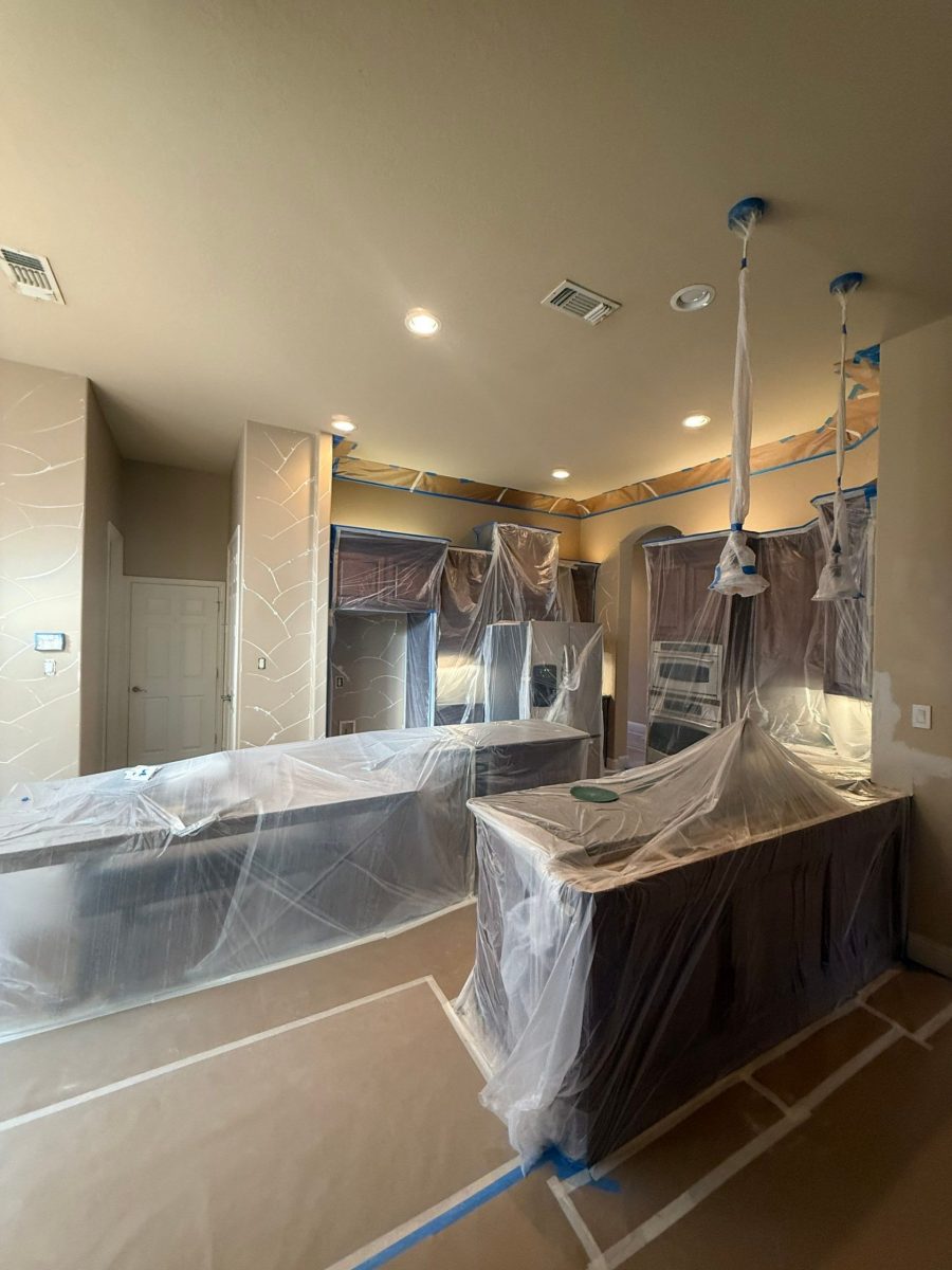 kitchen with protective coverings for painting Preview Image 1