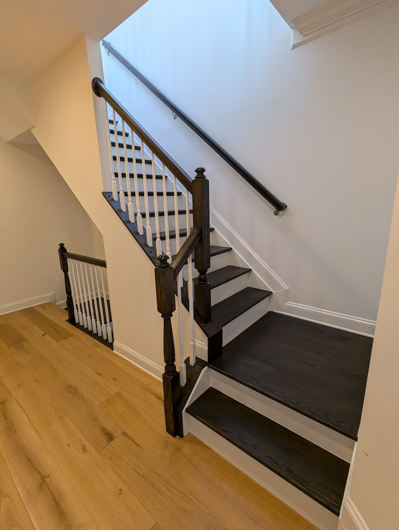 stair railing after being painted black