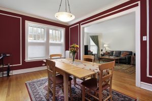 red living room with chair rail molding