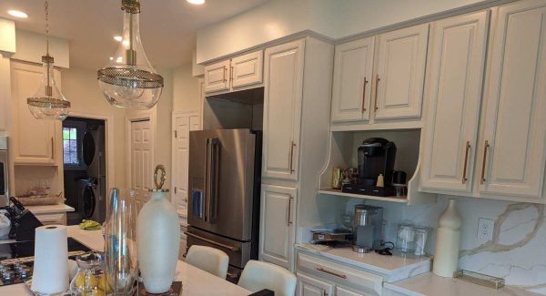 Freshly painted white kitchen cabinets at a home in Lothian, MD