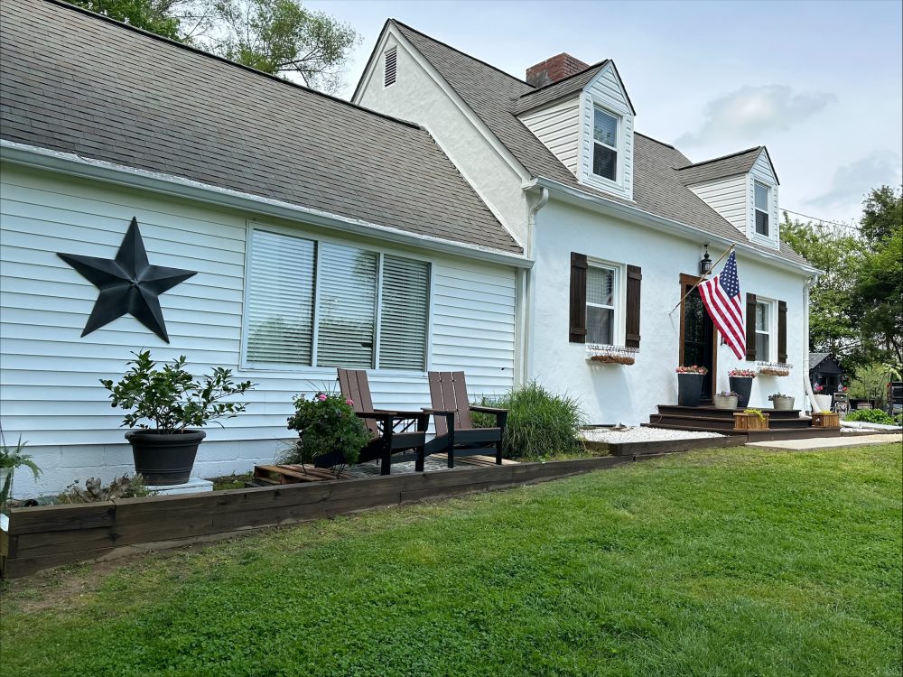 Painted white exterior of a residential home in Owings, MD