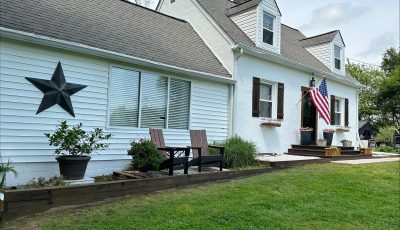 Painted white exterior of a residential home in Owings, MD