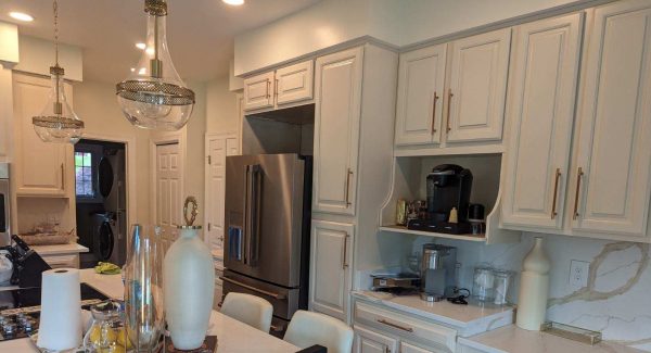 Freshly painted white kitchen cabinets at a home in Lothian, MD