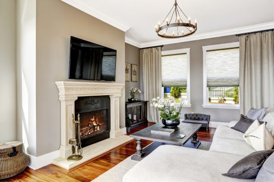 gray and white wood home with fireplace
